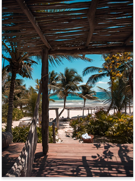 A view of the beach from an outdoor deck.