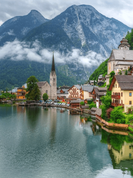 A small town with mountains in the background